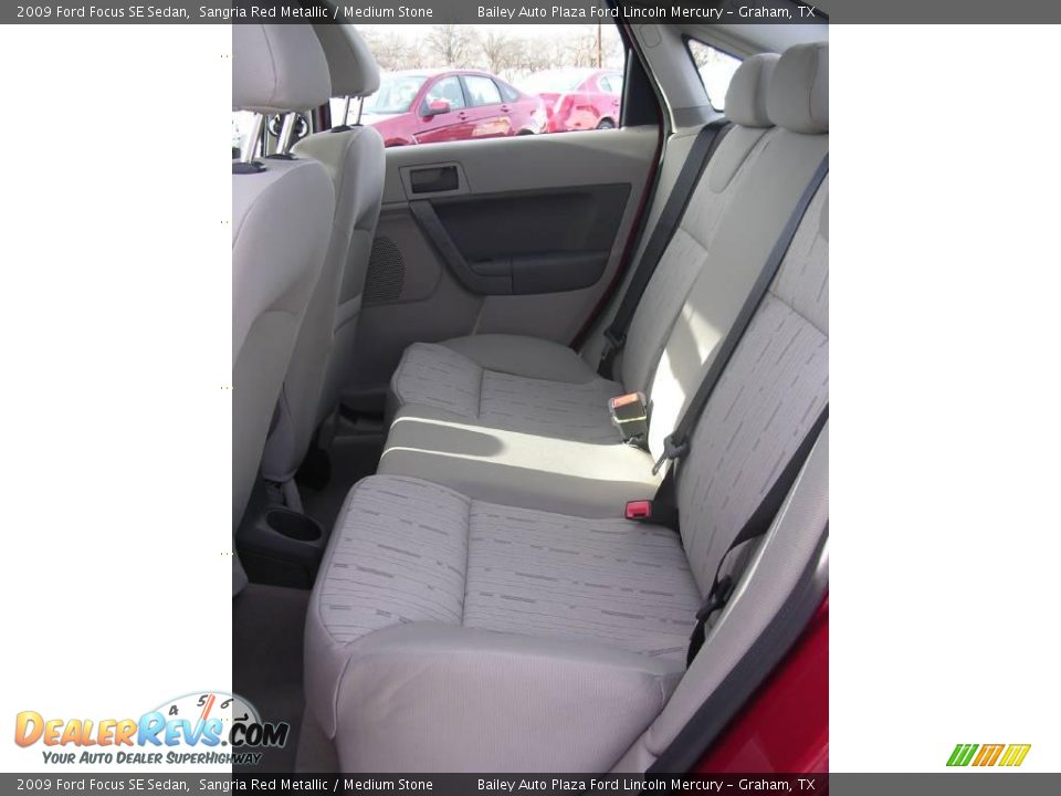 2009 Ford Focus SE Sedan Sangria Red Metallic / Medium Stone Photo #6