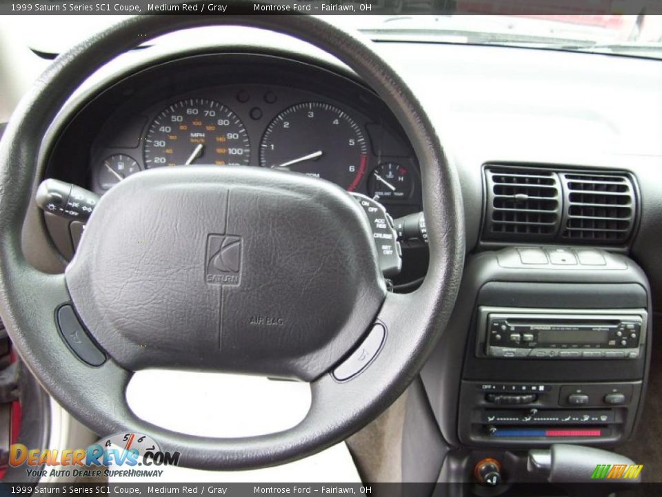 Dashboard of 1999 Saturn S Series SC1 Coupe Photo #22