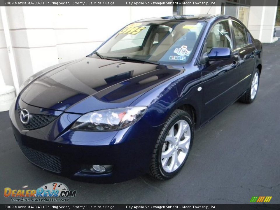 Front 3/4 View of 2009 Mazda MAZDA3 i Touring Sedan Photo #7