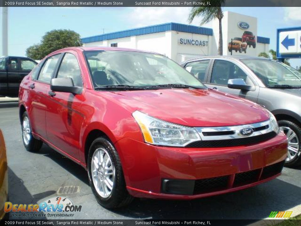 2009 Ford Focus SE Sedan Sangria Red Metallic / Medium Stone Photo #1