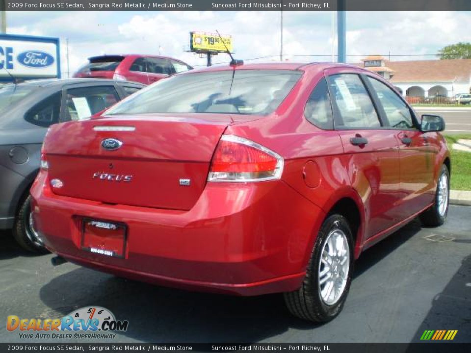 2009 Ford Focus SE Sedan Sangria Red Metallic / Medium Stone Photo #2
