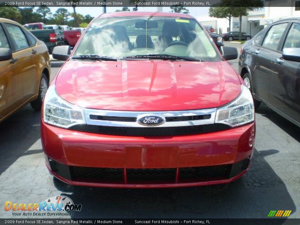 2009 Ford Focus SE Sedan Sangria Red Metallic / Medium Stone Photo #3