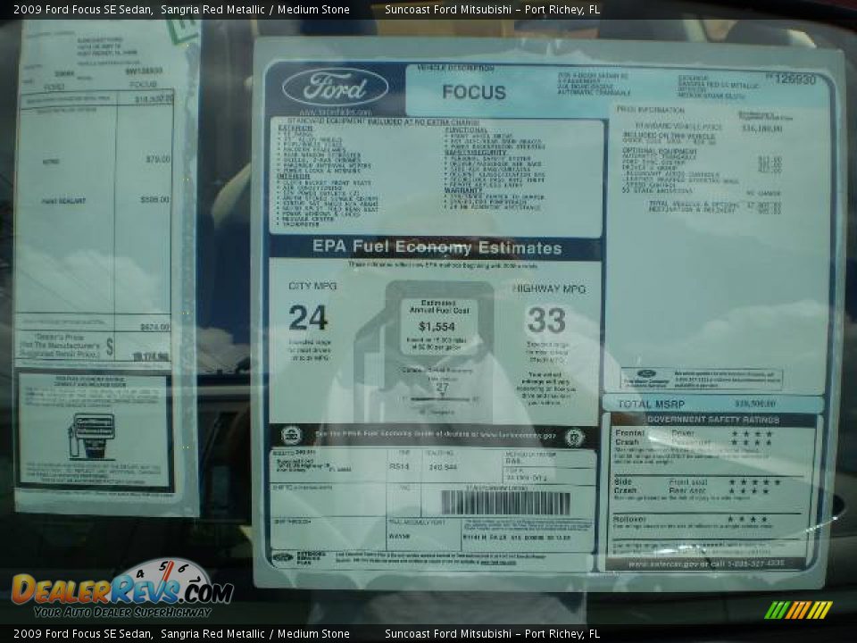 2009 Ford Focus SE Sedan Sangria Red Metallic / Medium Stone Photo #8