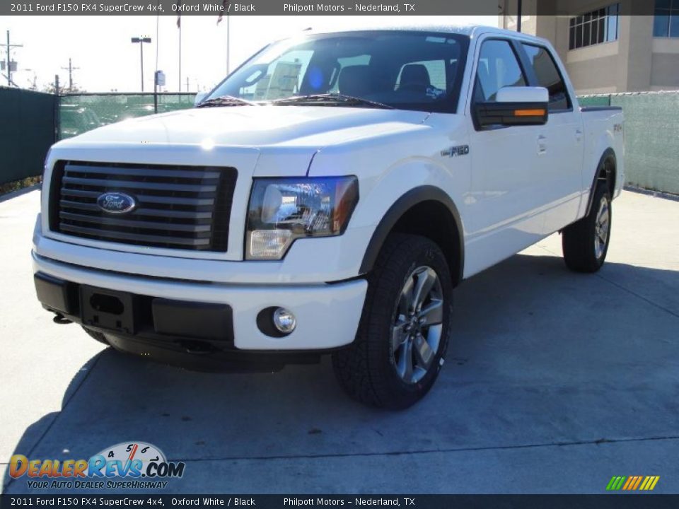 Front 3/4 View of 2011 Ford F150 FX4 SuperCrew 4x4 Photo #7