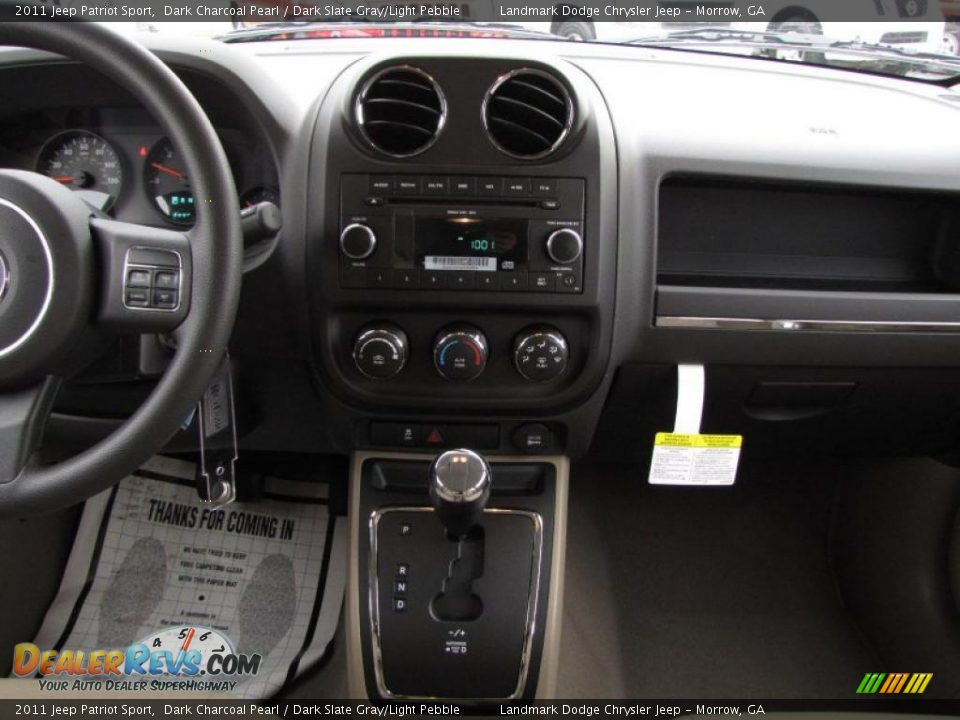 Dashboard of 2011 Jeep Patriot Sport Photo 10