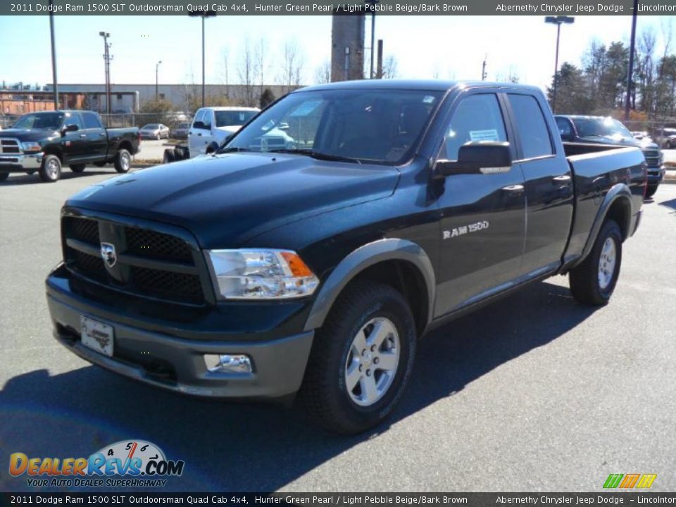 Front 3/4 View of 2011 Dodge Ram 1500 SLT Outdoorsman Quad Cab 4x4 Photo #1