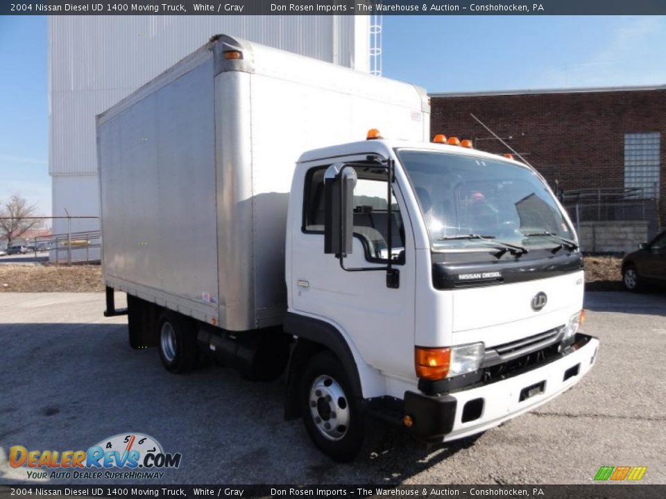 Front 3/4 View of 2004 Nissan Diesel UD 1400 Moving Truck Photo #4