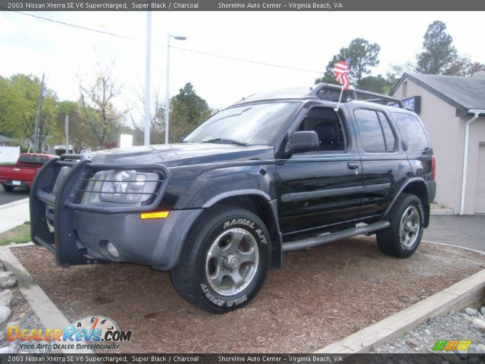 Front 3/4 View of 2003 Nissan Xterra SE V6 Supercharged Photo #1