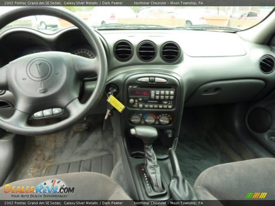 Dashboard of 2002 Pontiac Grand Am SE Sedan Photo #8