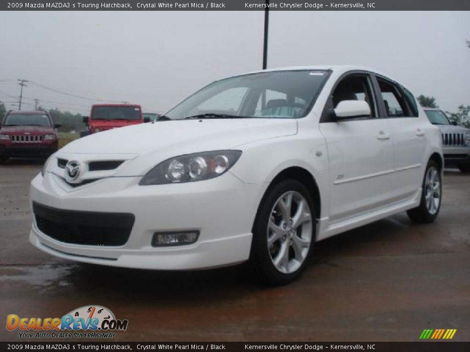Front 3/4 View of 2009 Mazda MAZDA3 s Touring Hatchback Photo #7