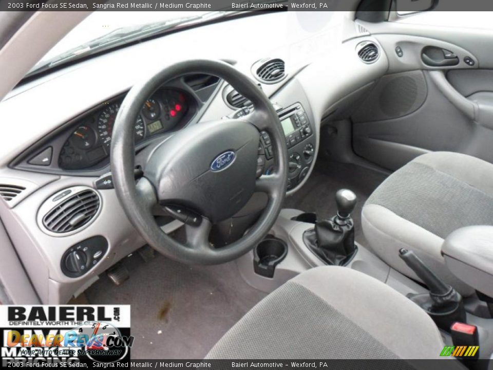 2003 Ford Focus SE Sedan Sangria Red Metallic / Medium Graphite Photo #11