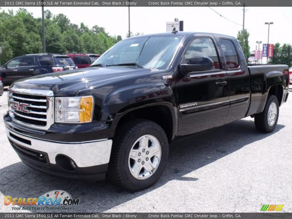 Front 3/4 View of 2011 GMC Sierra 1500 SLE All Terrain Extended Cab Photo #3