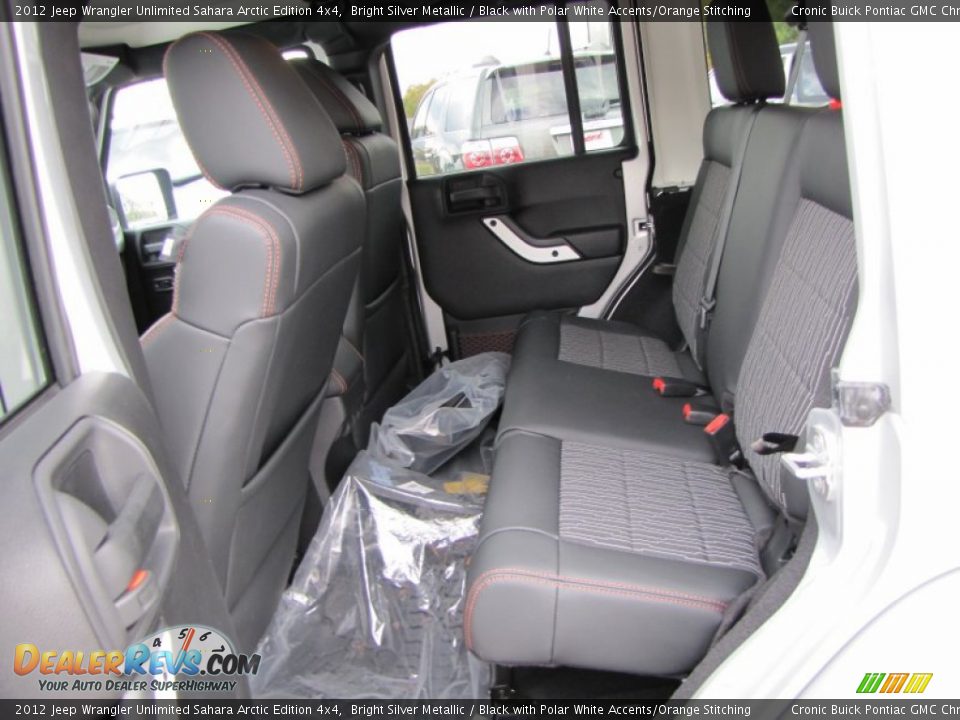 Black with Polar White Accents/Orange Stitching Interior - 2012 Jeep Wrangler Unlimited Sahara Arctic Edition 4x4 Photo #12