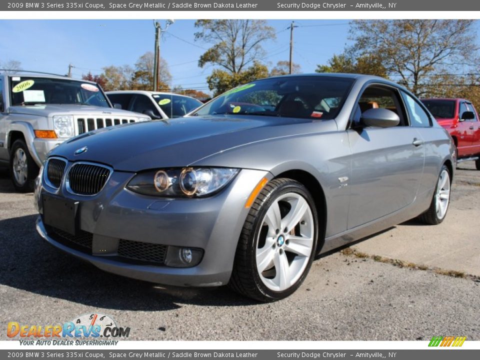 Front 3/4 View of 2009 BMW 3 Series 335xi Coupe Photo #1