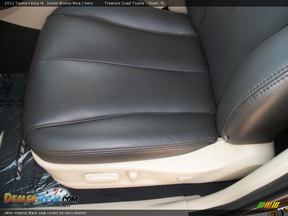 After-market Black seat covers on Ivory interior - 2011 Toyota Venza