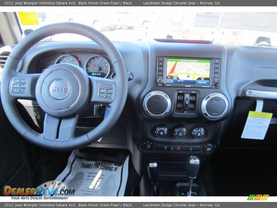 Dashboard of 2012 Jeep Wrangler Unlimited Sahara 4x4 Photo #11