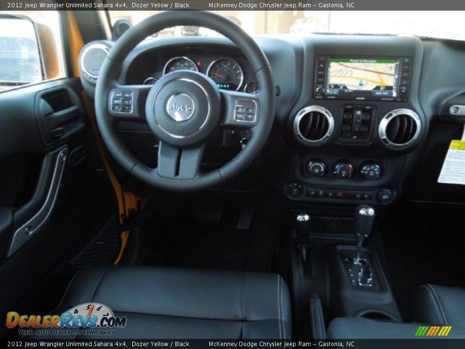 2012 Jeep Wrangler Unlimited Sahara 4x4 Dozer Yellow / Black Photo #16