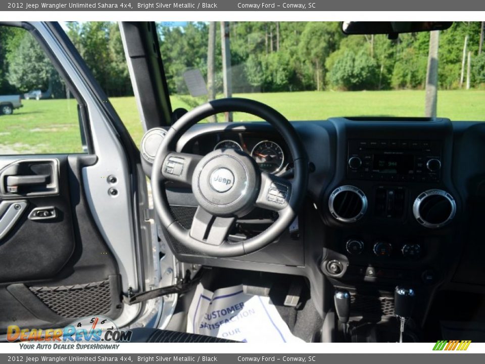 2012 Jeep Wrangler Unlimited Sahara 4x4 Bright Silver Metallic / Black Photo #14