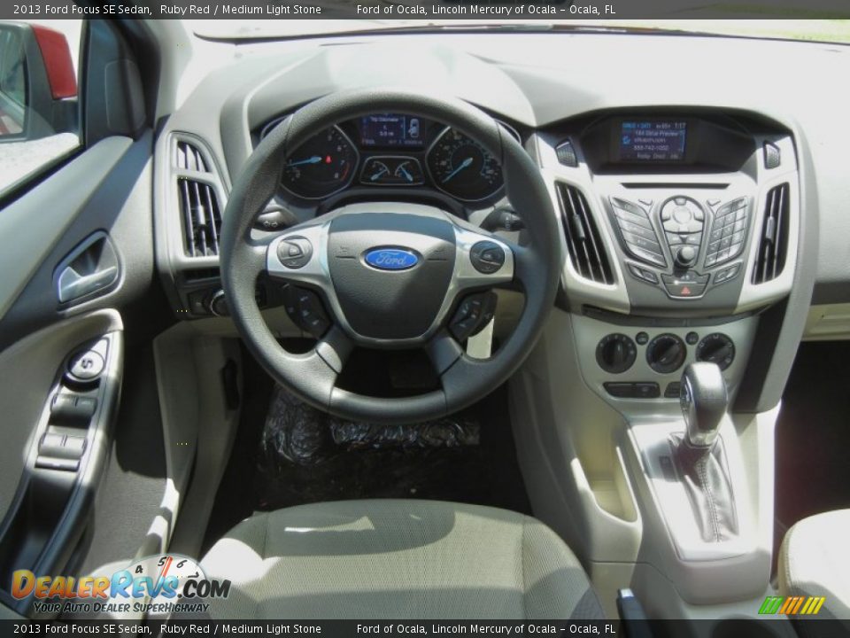 2013 Ford Focus SE Sedan Ruby Red / Medium Light Stone Photo #7