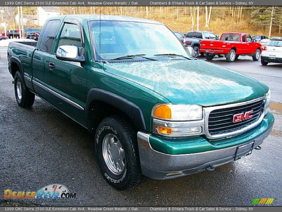 Front 3/4 View of 1999 GMC Sierra 1500 SLE Extended Cab 4x4 Photo #8