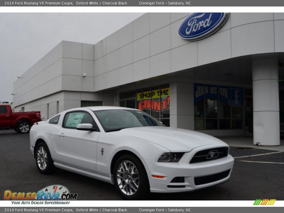 Front 3/4 View of 2014 Ford Mustang V6 Premium Coupe Photo #1