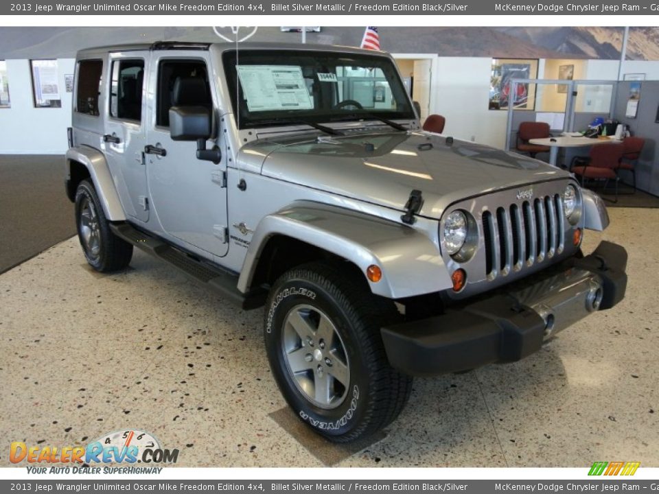 Front 3/4 View of 2013 Jeep Wrangler Unlimited Oscar Mike Freedom Edition 4x4 Photo #1