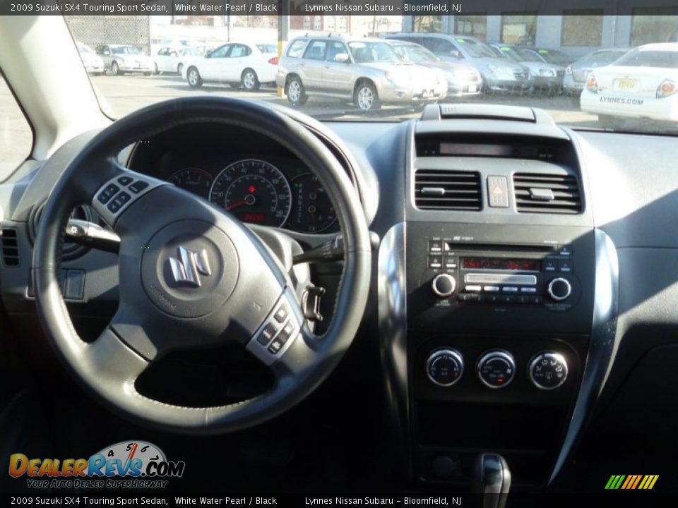 2009 Suzuki SX4 Touring Sport Sedan White Water Pearl / Black Photo #16