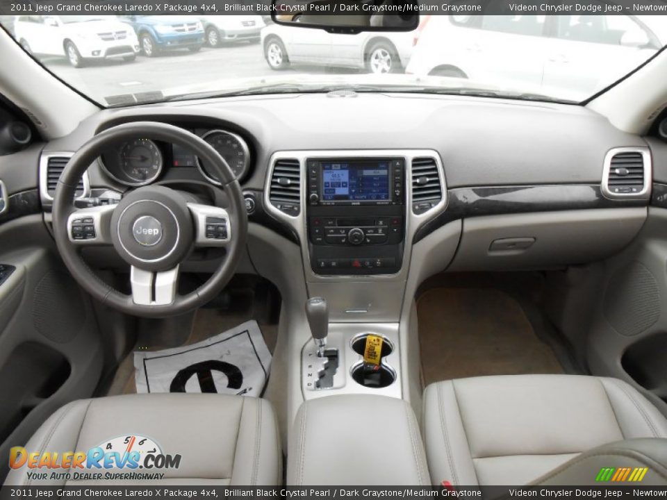Dashboard of 2011 Jeep Grand Cherokee Laredo X Package 4x4 Photo #11