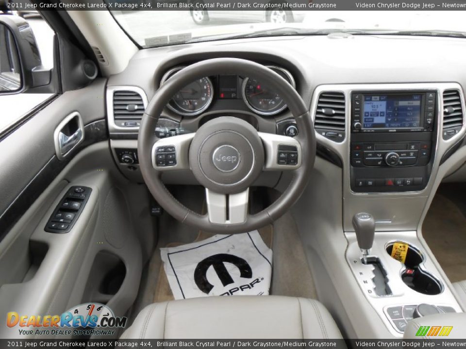 Dashboard of 2011 Jeep Grand Cherokee Laredo X Package 4x4 Photo #12