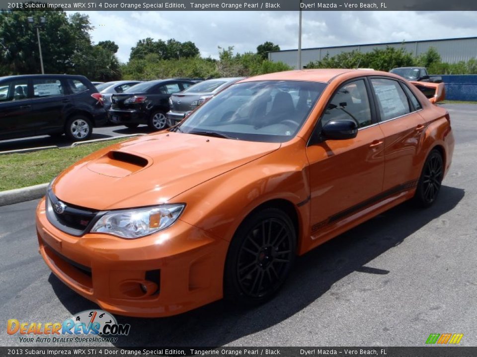 Front 3/4 View of 2013 Subaru Impreza WRX STi 4 Door Orange Special Edition Photo #1
