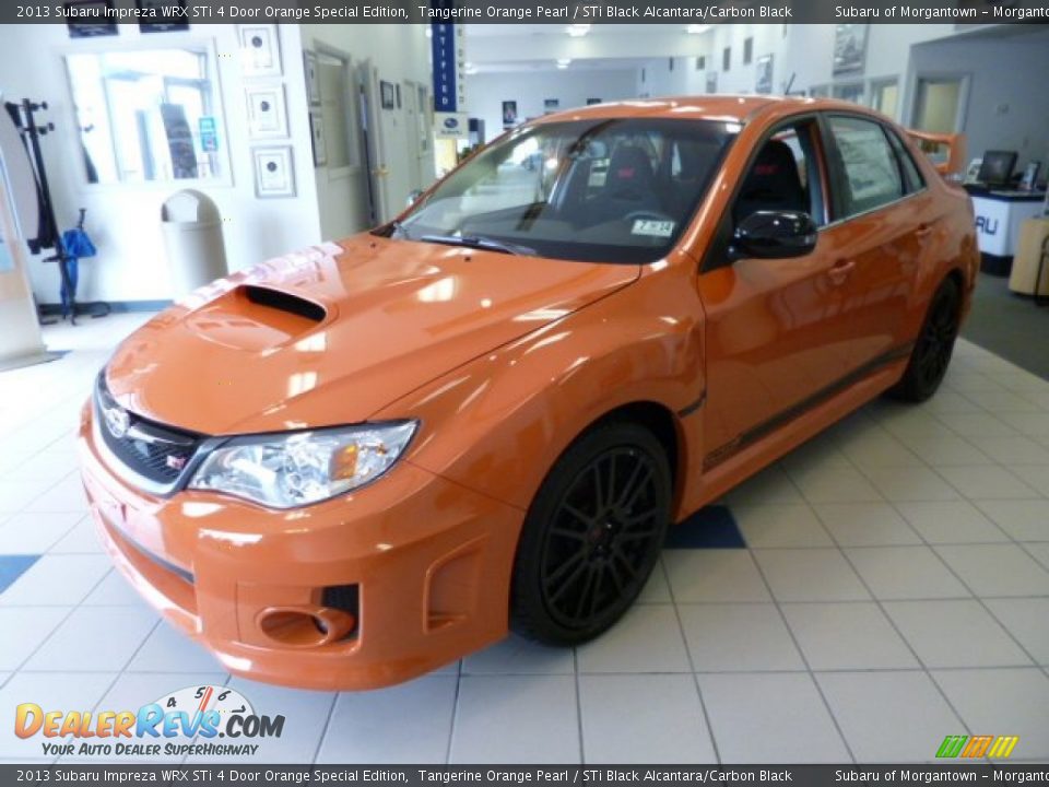 Front 3/4 View of 2013 Subaru Impreza WRX STi 4 Door Orange Special Edition Photo #3