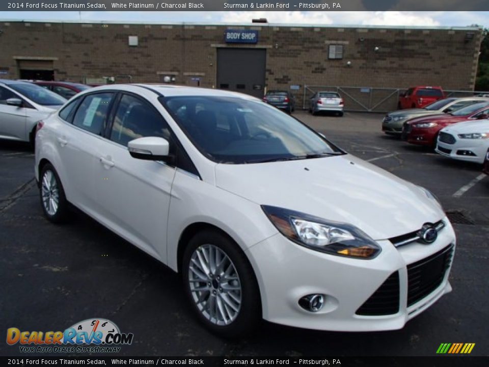 Front 3/4 View of 2014 Ford Focus Titanium Sedan Photo #1