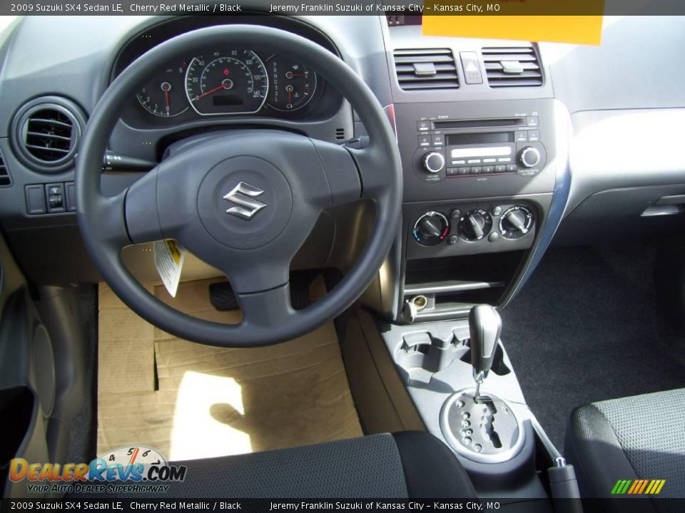 2009 Suzuki SX4 Sedan LE Cherry Red Metallic / Black Photo #9