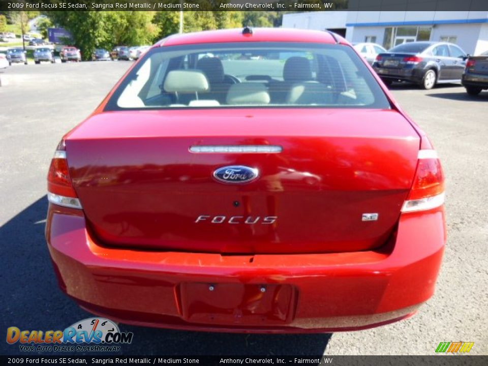 2009 Ford Focus SE Sedan Sangria Red Metallic / Medium Stone Photo #5