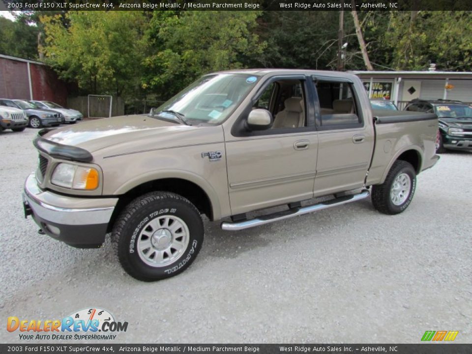 Front 3/4 View of 2003 Ford F150 XLT SuperCrew 4x4 Photo #10