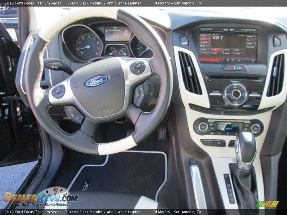 2012 Ford Focus Titanium Sedan Tuxedo Black Metallic / Arctic White Leather Photo #11