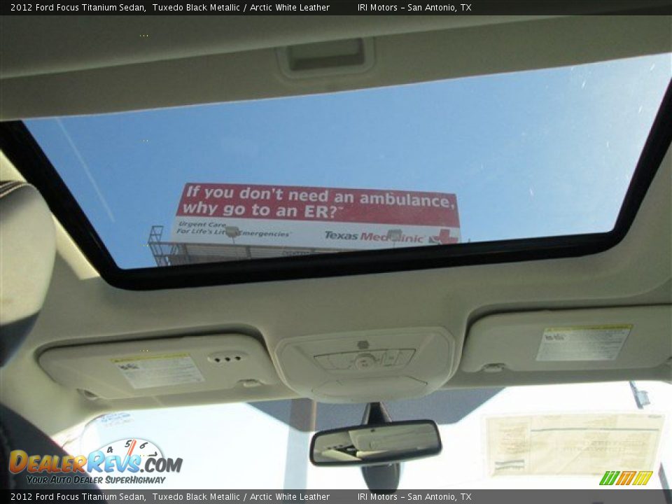 2012 Ford Focus Titanium Sedan Tuxedo Black Metallic / Arctic White Leather Photo #12