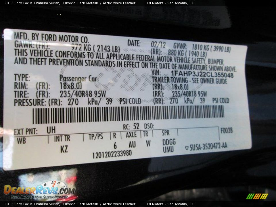 2012 Ford Focus Titanium Sedan Tuxedo Black Metallic / Arctic White Leather Photo #13