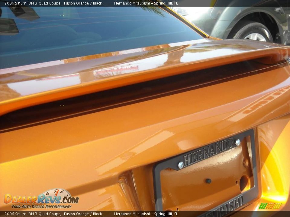 2006 Saturn ION 3 Quad Coupe Fusion Orange / Black Photo #5