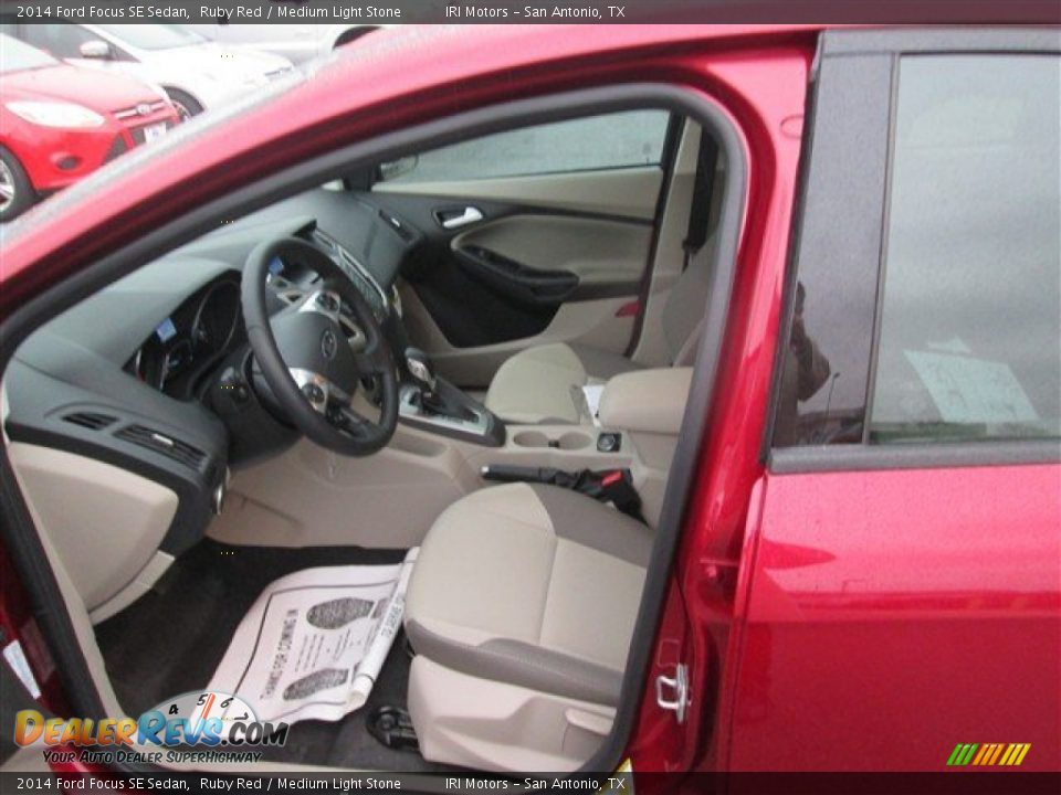 2014 Ford Focus SE Sedan Ruby Red / Medium Light Stone Photo #7