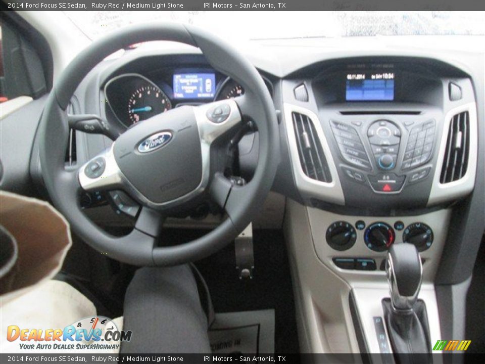 2014 Ford Focus SE Sedan Ruby Red / Medium Light Stone Photo #8