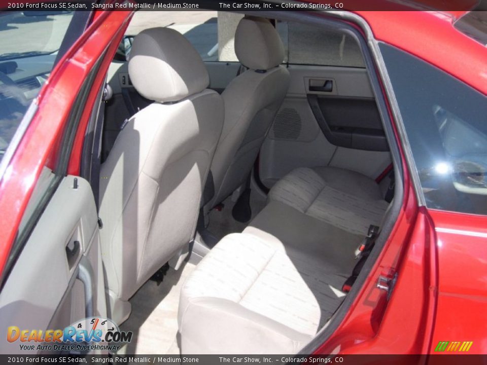 2010 Ford Focus SE Sedan Sangria Red Metallic / Medium Stone Photo #7
