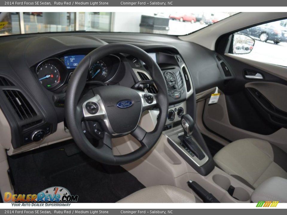 2014 Ford Focus SE Sedan Ruby Red / Medium Light Stone Photo #7