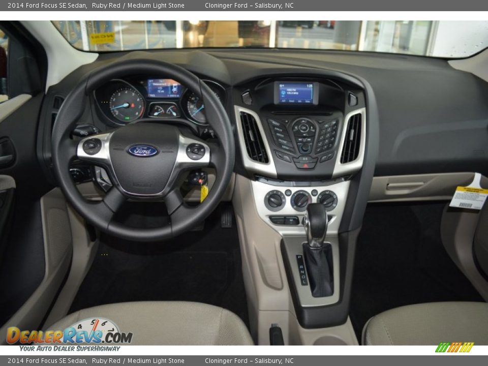 2014 Ford Focus SE Sedan Ruby Red / Medium Light Stone Photo #11