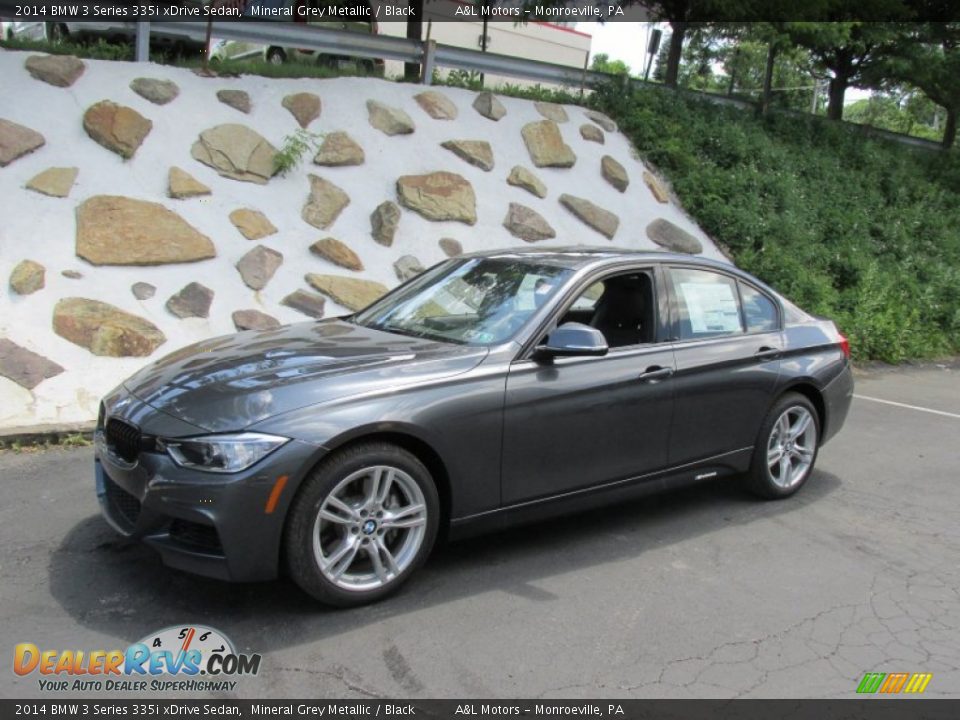Front 3/4 View of 2014 BMW 3 Series 335i xDrive Sedan Photo #1