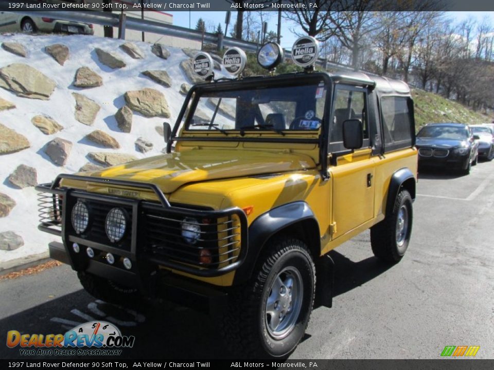 Front 3/4 View of 1997 Land Rover Defender 90 Soft Top Photo #9