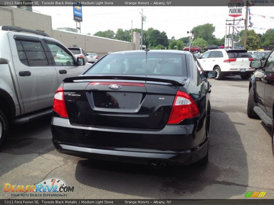 2011 Ford Fusion SE Tuxedo Black Metallic / Medium Light Stone Photo #4