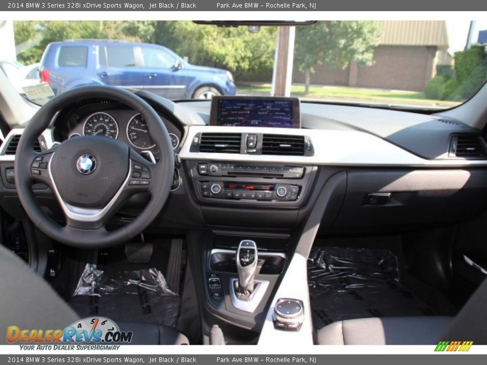 Dashboard of 2014 BMW 3 Series 328i xDrive Sports Wagon Photo #14