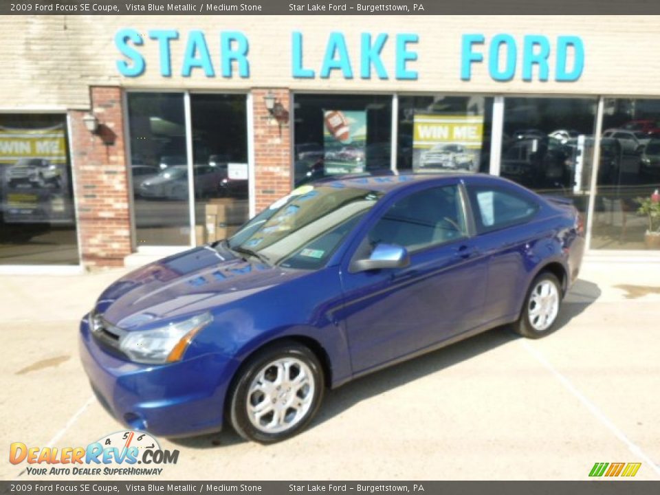 2009 Ford Focus SE Coupe Vista Blue Metallic / Medium Stone Photo #1