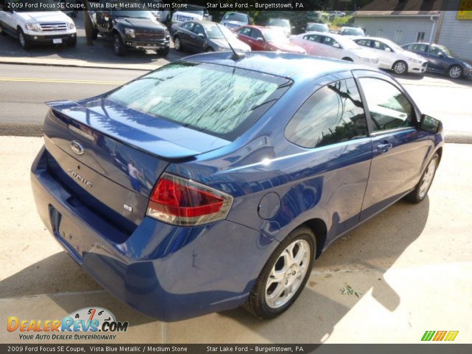2009 Ford Focus SE Coupe Vista Blue Metallic / Medium Stone Photo #5